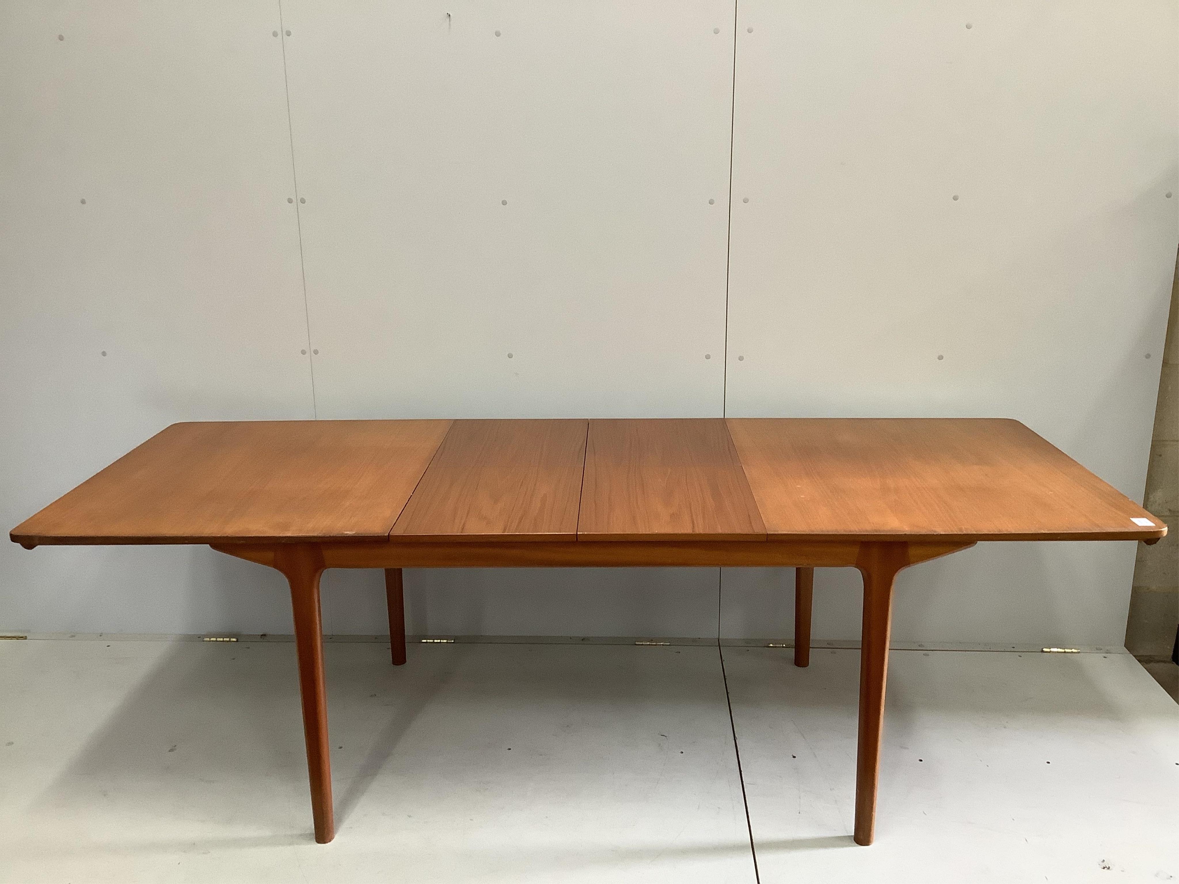 McIntosh of Kirkcaldy, a mid century teak extending dining table, width 159cm, depth 89cm, height 74cm. Condition - good